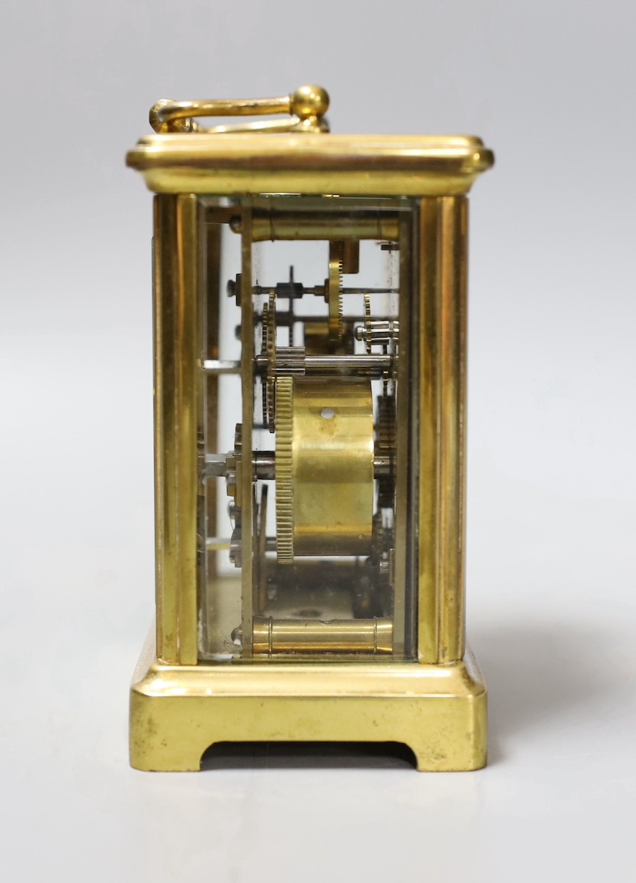 A brass carriage timepiece, retailed by J. Moser & co. in leather case with key.